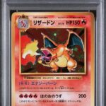 PSA 9 CHARIZARD-HOLO 20TH ANNIV-1ST ED.